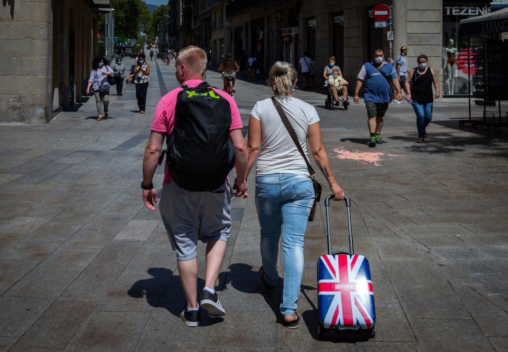 British tourists stroll through the center of Barcelona